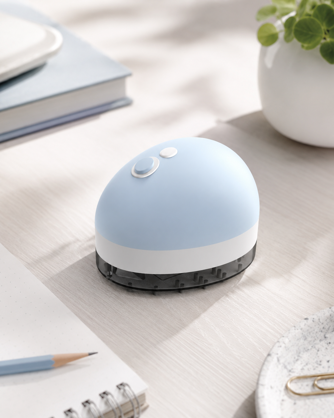 Droplet mini desktop vacuum on a desk